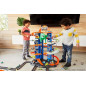 Hot Wheels Ultimate Garage City vs Robo Beasts – Meerniveaus racebaan met bewegende T-Rex en 2 auto's
